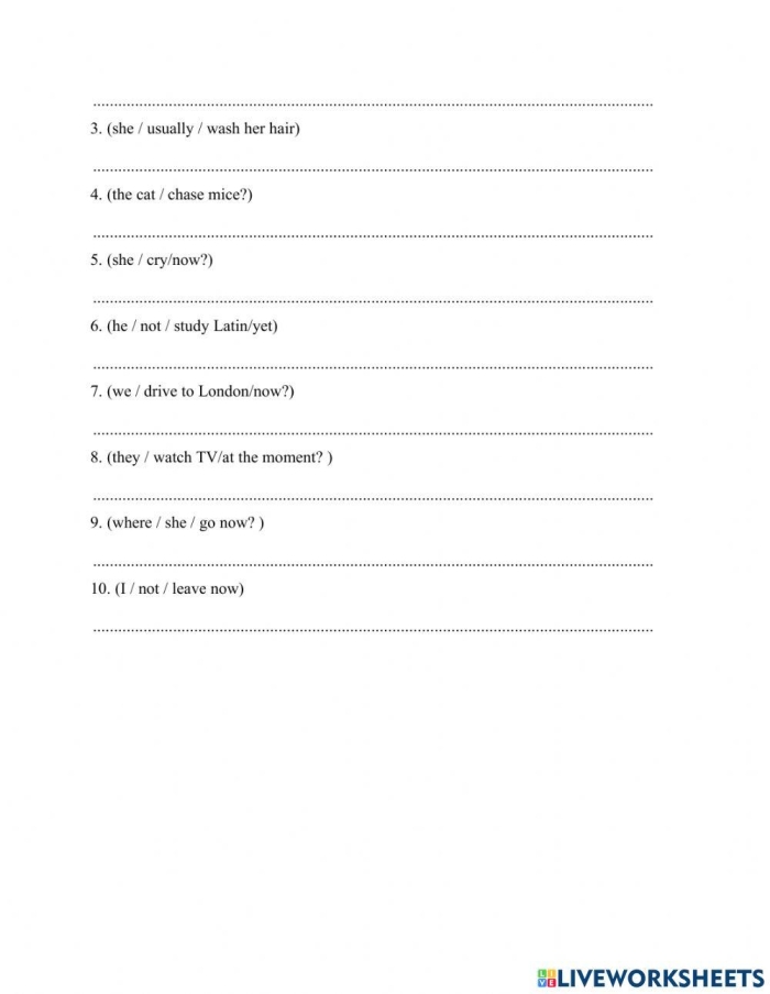Second grade students completing a grammar worksheet about present tense verb endings