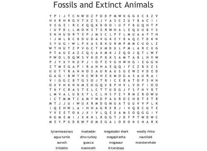 Third grade students solving a fossils and extinct animals crossword puzzle worksheet for life science