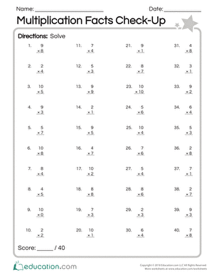 Third grade student completing a math assessment on multiplication facts up to ten