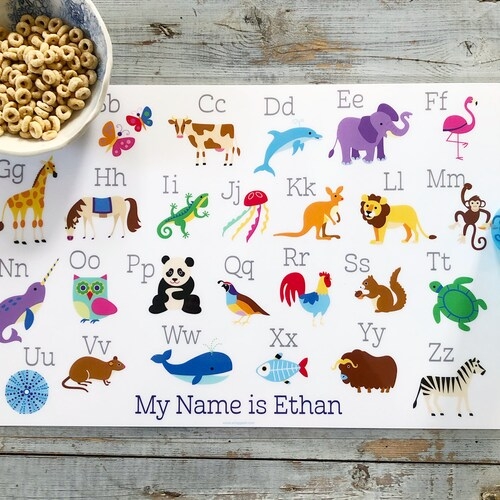 Colorful Animal Alphabet Placemat worksheet for Pre-K learners featuring animals for each letter