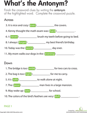 Second grade student solving an antonym crossword puzzle worksheet