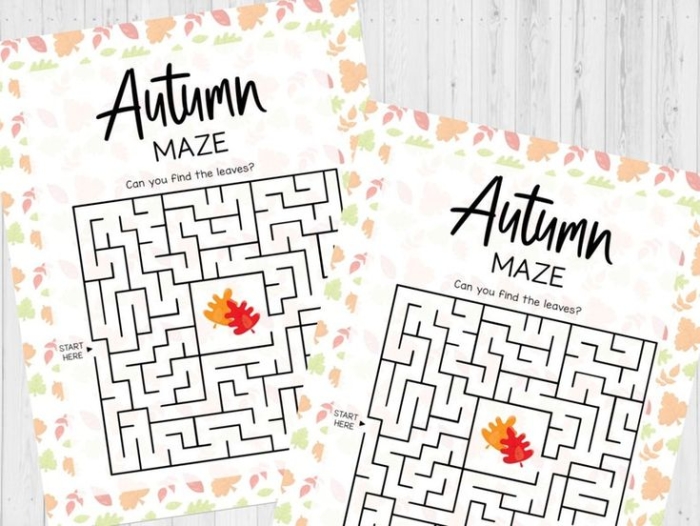 Fall Maze Activity for Beginning Writers First grade student tracing a path through an autumn-themed maze from start to finish