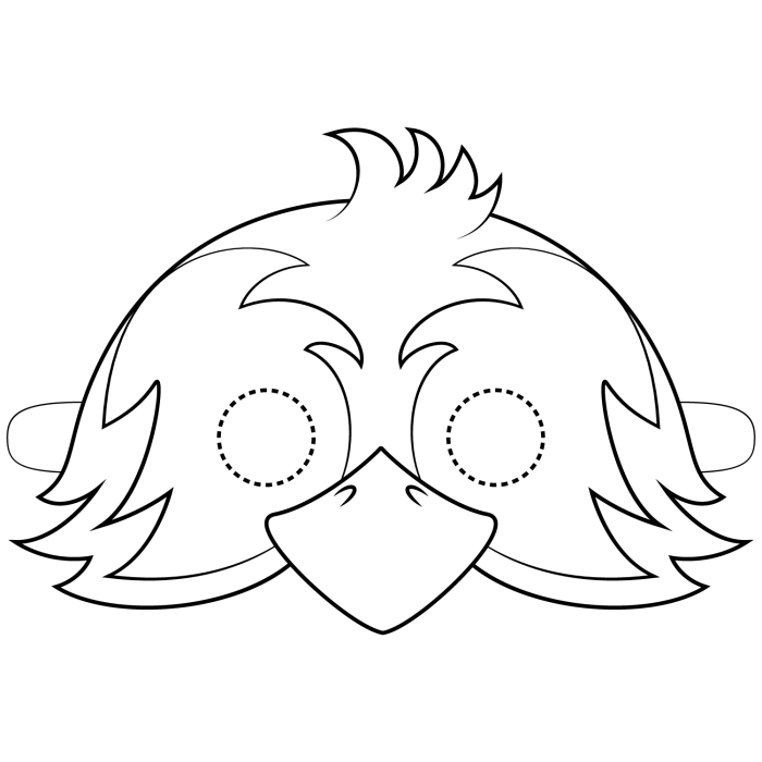 First grade student cutting out a colorful bird mask craft for a life science lesson