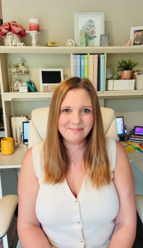 Pre-K student working on a color by number fruit worksheet featuring healthy snacks