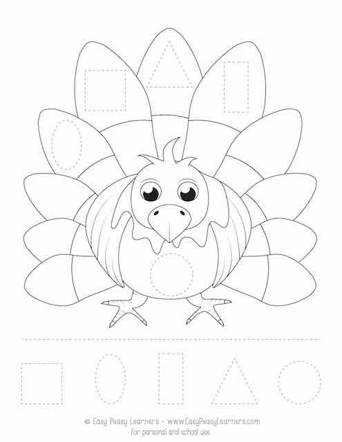 Kindergarten student assembling a funny turkey decoration with cut-and-paste pilgrim clothing and bird body parts