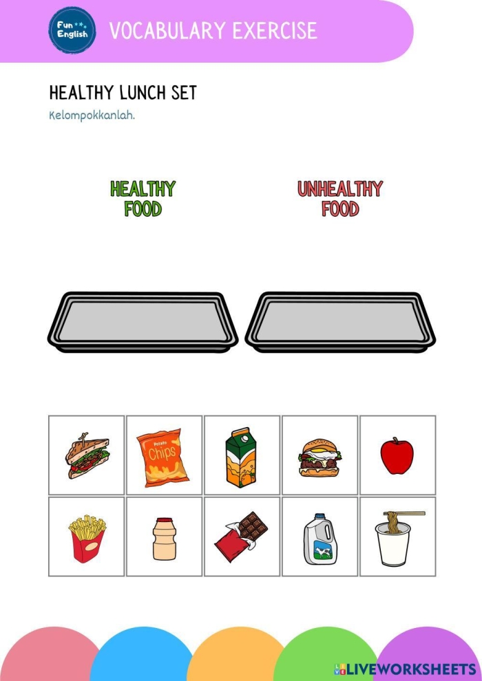 Preschool student arranging paper food items for the Cut and Paste a Healthy Lunch worksheet
