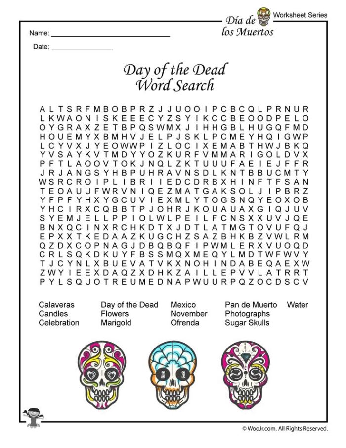 First grade student coloring a festive paper sugar skull worksheet for Day of the Dead