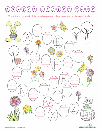 Pre-K student working on an Easter alphabet maze phonics worksheet tracing letters for the bunny