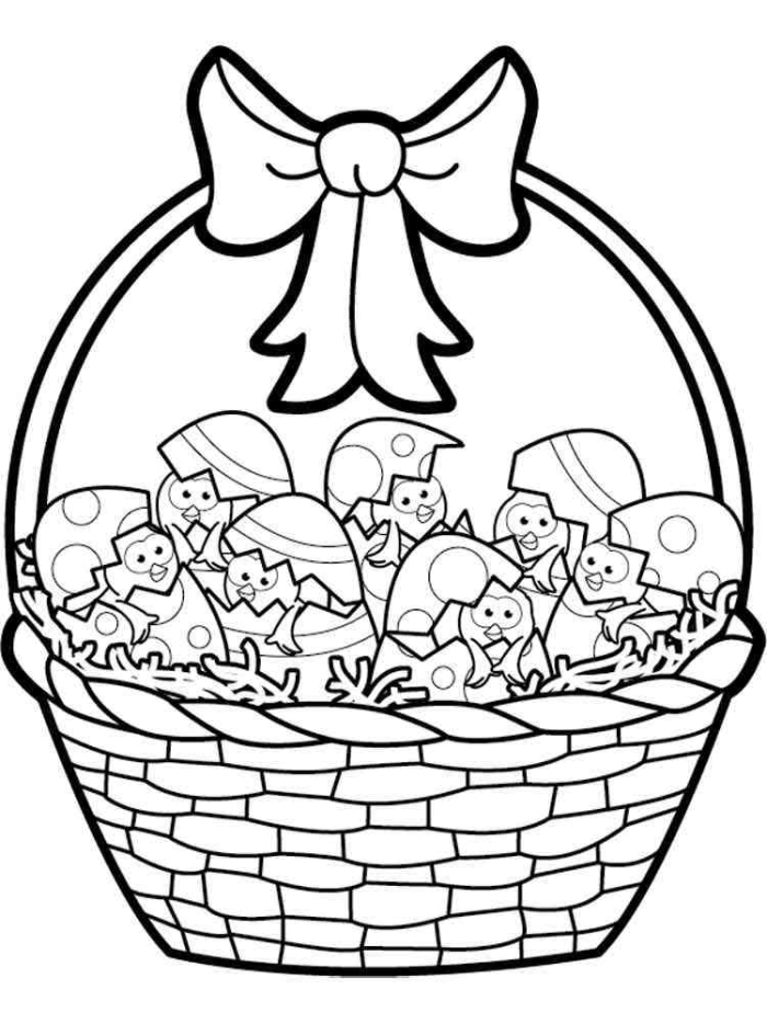 Preschooler coloring a festive Easter basket with painted eggs for phonics practice