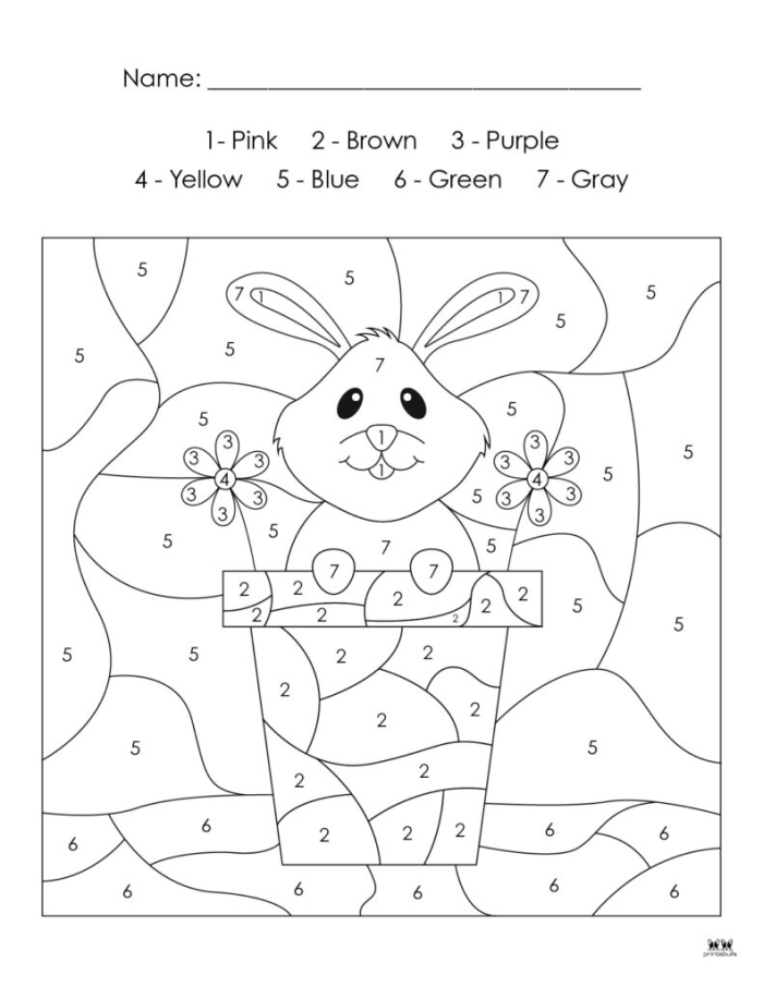Kindergarten student completing an Easter egg color by number grammar worksheet