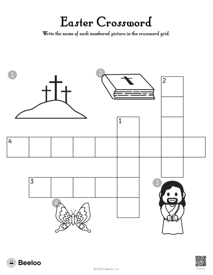 Second grade students solving an Easter-themed crossword puzzle worksheet with spring holiday vocabulary