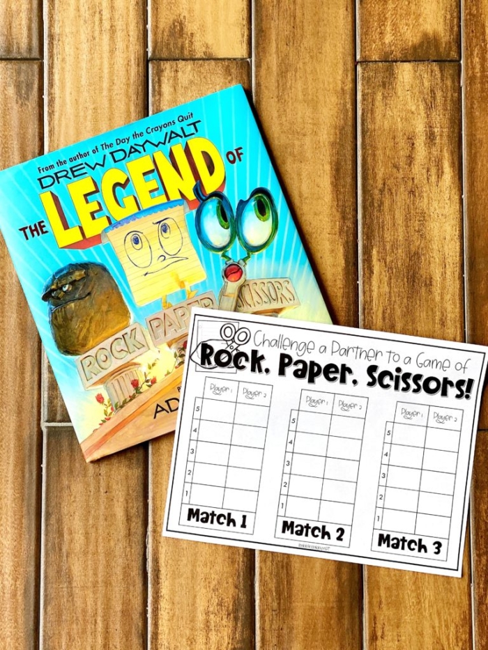 Two children playing rock paper scissors game showing hand gestures for probability learning