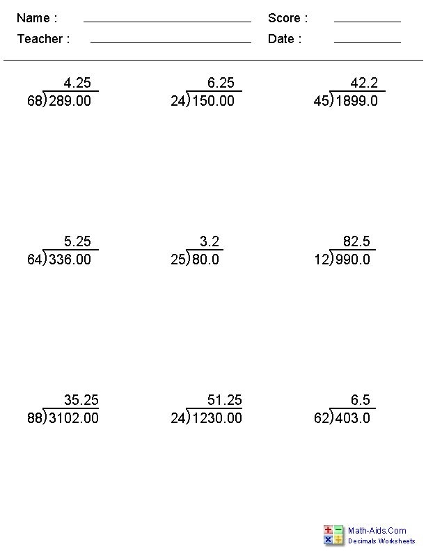Students practicing division of multi-digit decimal numbers on a worksheet