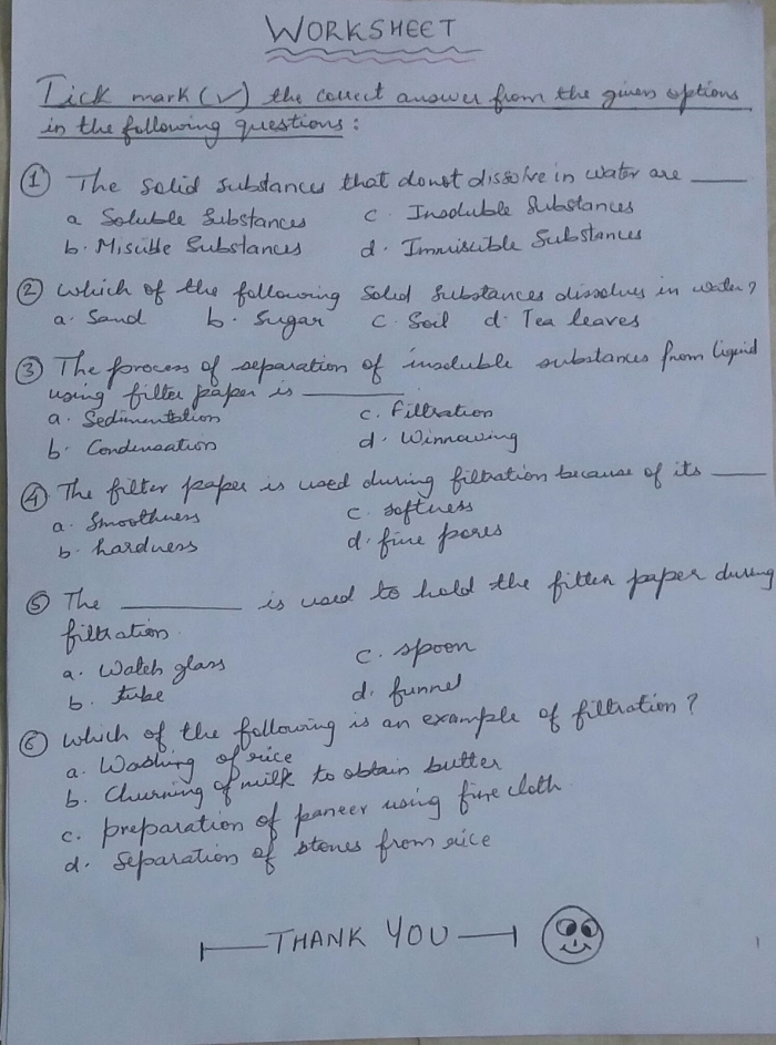 Fifth grade student sorting labels to complete a life science filtration system worksheet