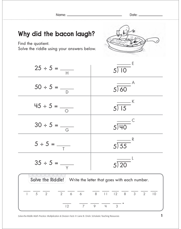 Fifth grade student solving a Halloween division riddle worksheet featuring long division problems