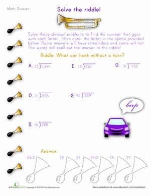 Fifth grade student solving a Halloween long division riddle worksheet with measurement problems