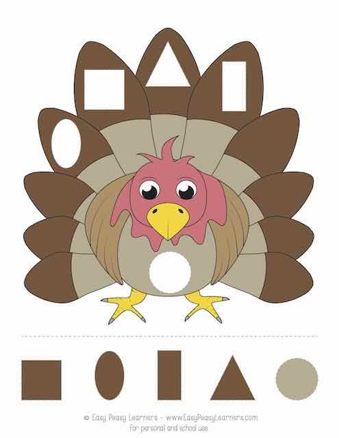 Kindergarten student assembling a cut-and-paste turkey worksheet with pilgrim clothing