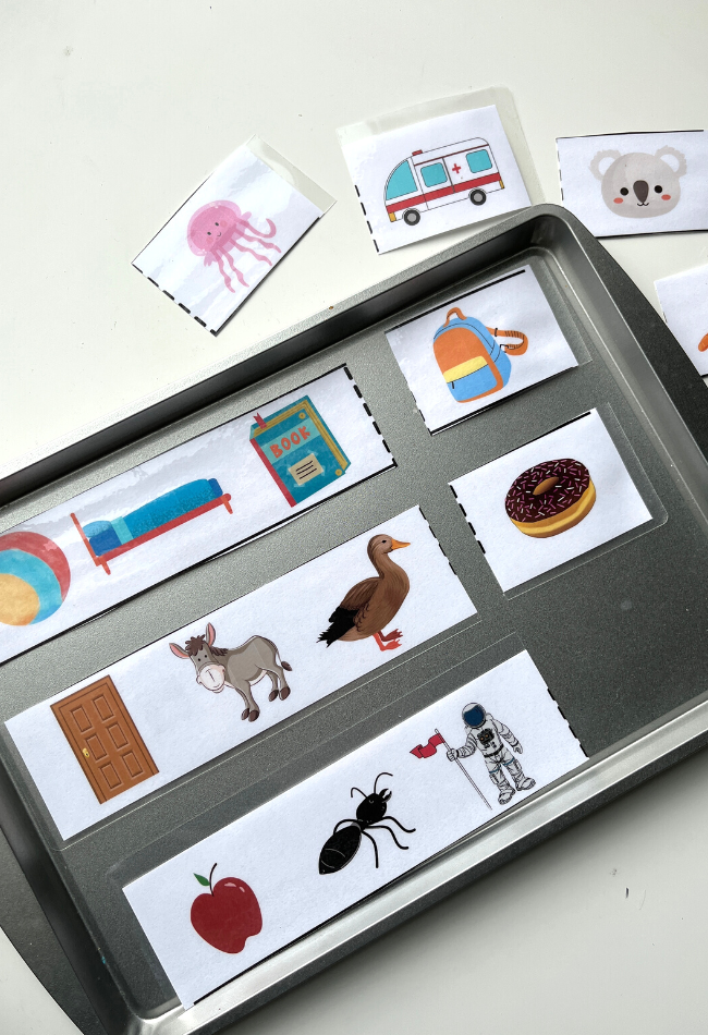 First grade student completing a phonics exercise about repeating consonant sounds