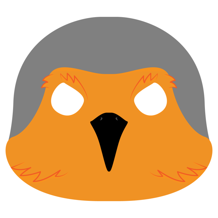 First grade student cutting out a colorful bird mask for a life science activity