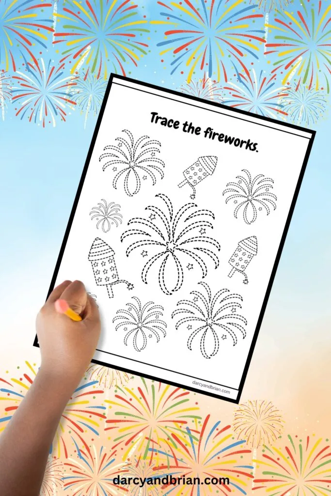A first grade student using a creative fireworks drawing worksheet for an Independence Day lesson