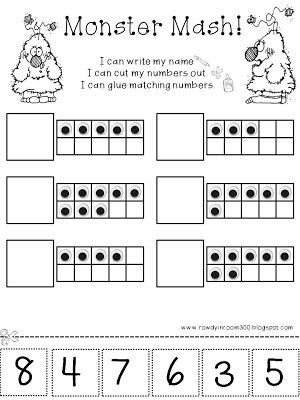 First grade student using scissors to cut out colorful monster cards for a memory game