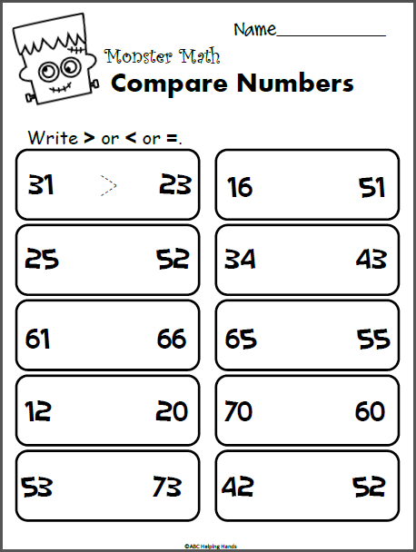A first grade student playing a Monster Match memory game with printable spooky character cards