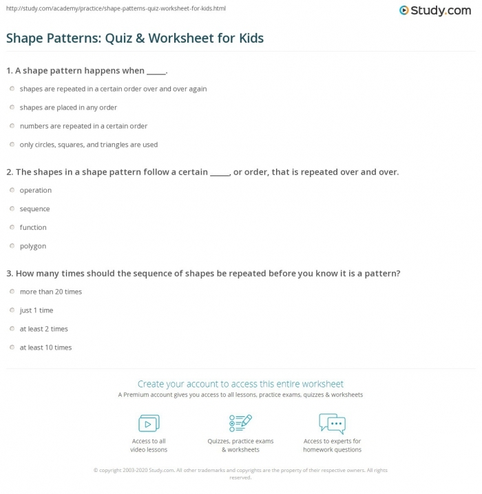 First grade students completing a colorful pattern quiz worksheet with shapes and colors to sort