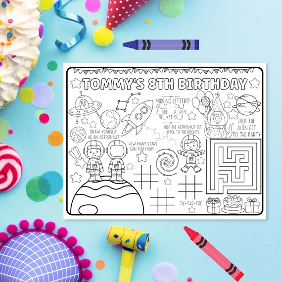 First grade worksheet featuring cut-out cards with cartoon sun and moon symbols for a space-themed tic-tac-toe game