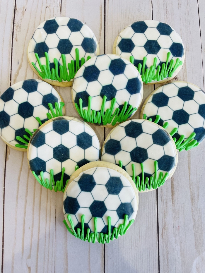 Fun division activity where students measure the largest football cookie baked by family members Football-themed measurement worksheet for third graders featuring cookie length comparisons