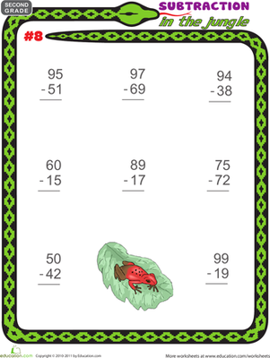 First grade student solving jungle-themed subtraction problems with regrouping practice