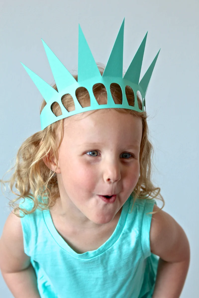 Colorful paper crown inspired by the Statue of Liberty for kids. Activity worksheet for creating a Lady Liberty crown.