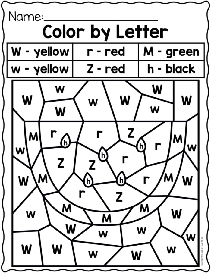 Color the Letters! division worksheet for kindergarteners image 18 Kindergarten student coloring uppercase and lowercase letters on a division themed worksheet 18