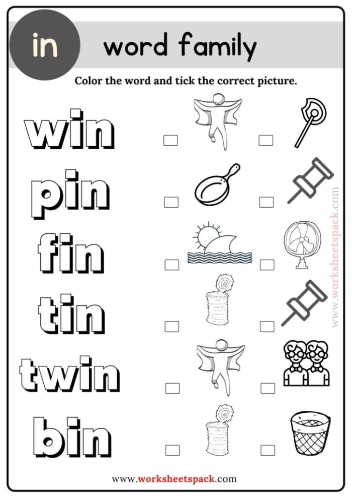 Kindergarten student completing word family worksheet by adding missing letters to at family words with picture clues
