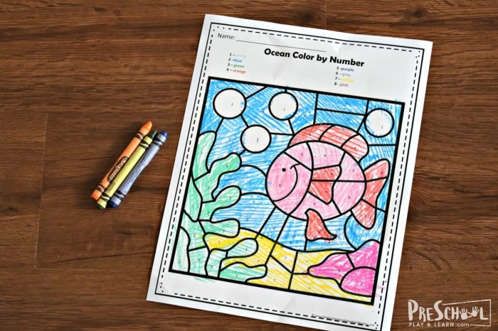 Kindergarten math worksheet with colorful sea creatures and simple addition problems for color by sum activity