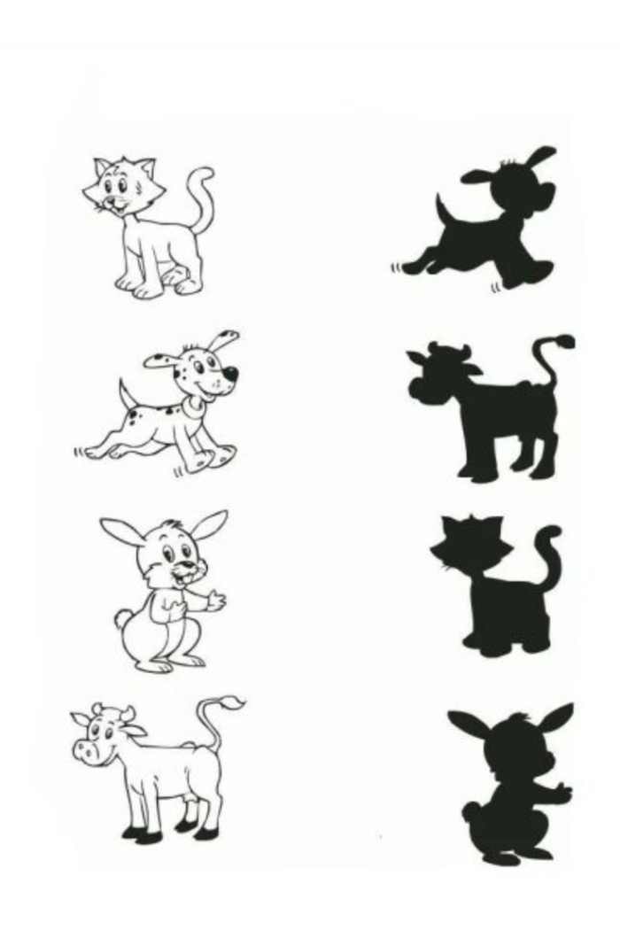 Kindergarten student matching CVC words to animal pictures on a reading worksheet