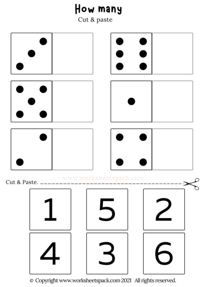 Kindergarten students practicing division with a fun food-themed worksheet