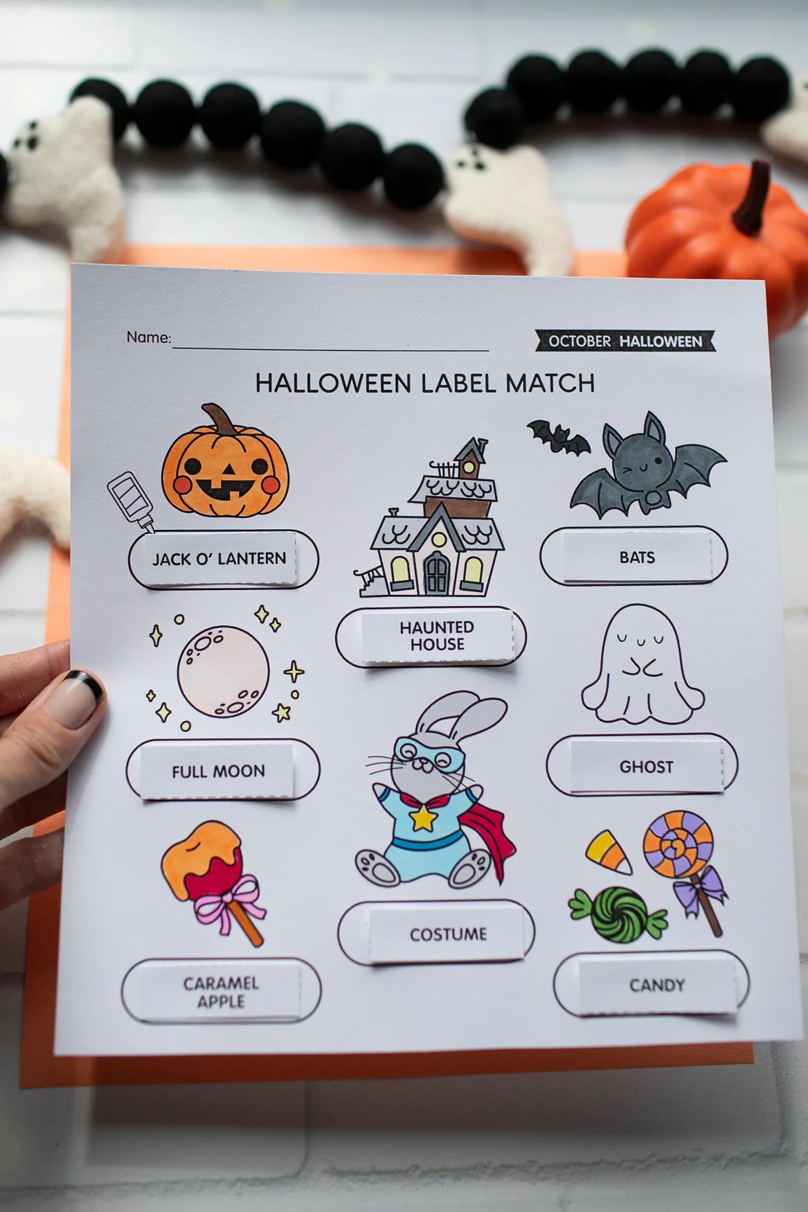 A fun Halloween night coloring page featuring a princess and a ninja in a pumpkin patch