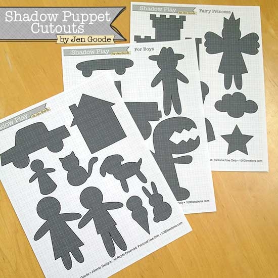 Kindergarten student using a Halloween shadow puppet worksheet to create spooky hand shapes