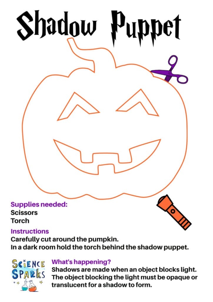 Kindergarten student holding a paper cutout of a bat for the Halloween Shadow Puppets worksheet activity