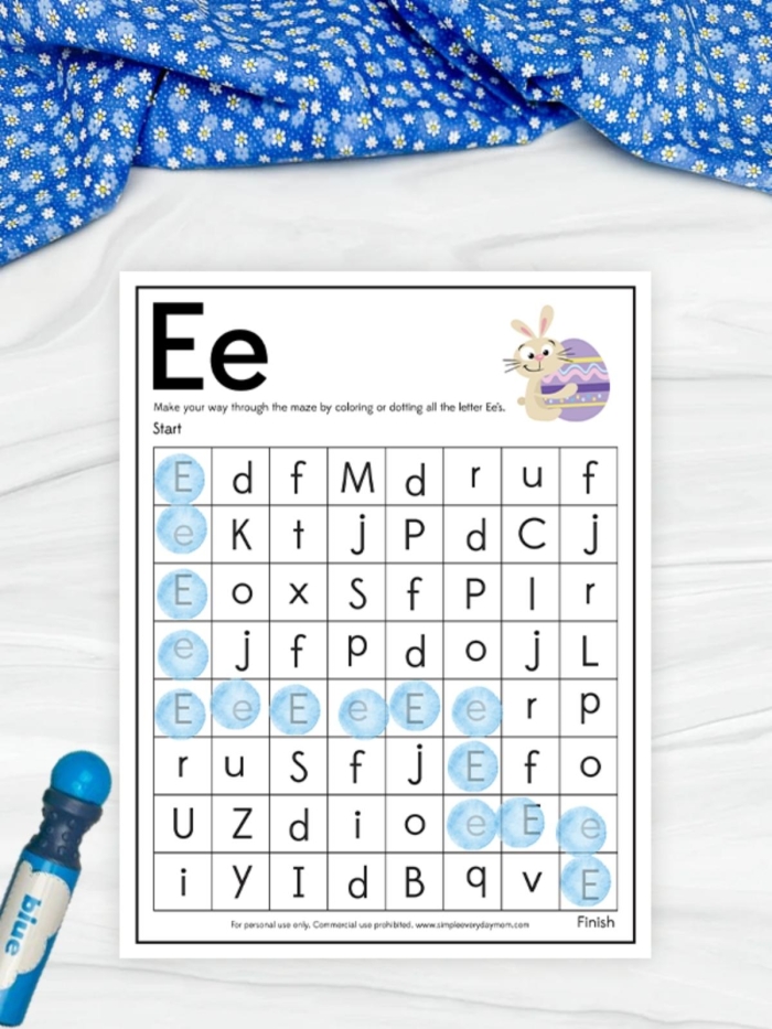 Kindergarten student practicing letter recognition on a worksheet by tracing the path from letter A to K