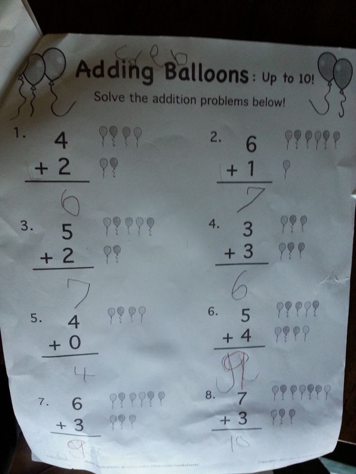 Kindergarten math worksheet featuring colorful balloons for practicing addition problems up to 10
