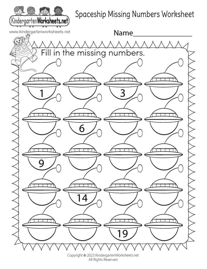 Kindergarten student filling in missing numbers from 1 to 50 on a worksheet