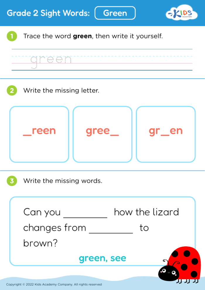 Kindergarten student tracing and writing the word green on a phonics practice worksheet