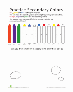A young student completing a colorful primary to secondary color mixing worksheet