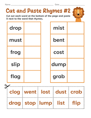 Kindergarten students cutting and pasting rhyming word pairs on a worksheet activity page