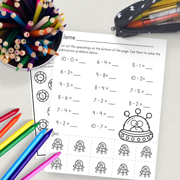 Subtracting in Space Kindergarten Math Worksheet 1 Kindergarten student using a space themed math worksheet to practice subtracting stars and rocketships