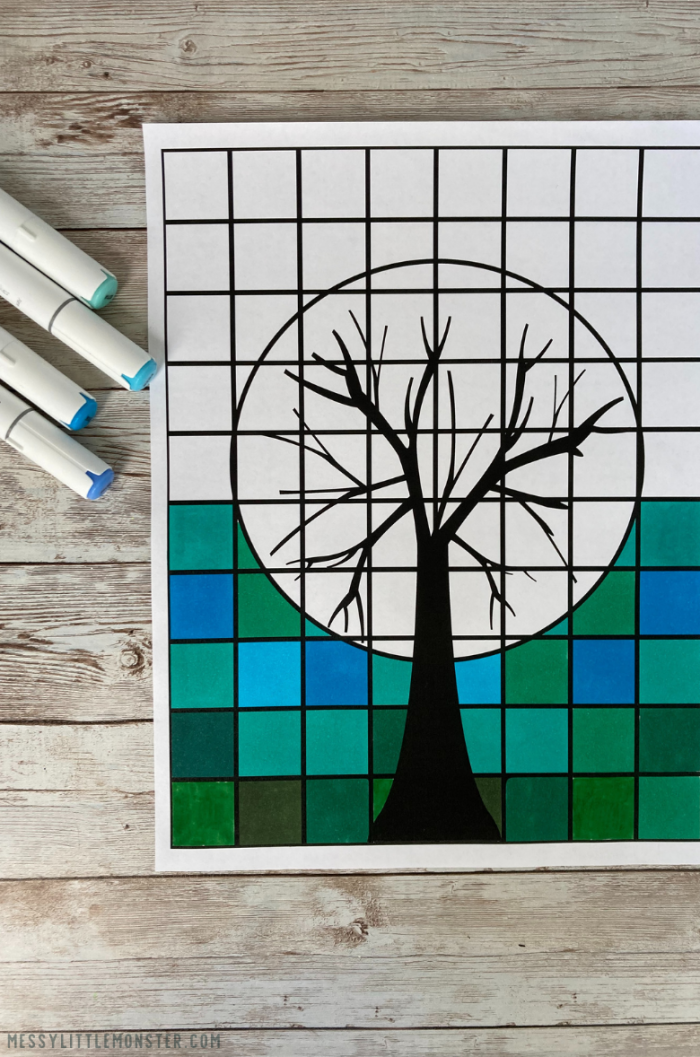 Kindergarten student coloring a beach scene to learn about warm and cool colors