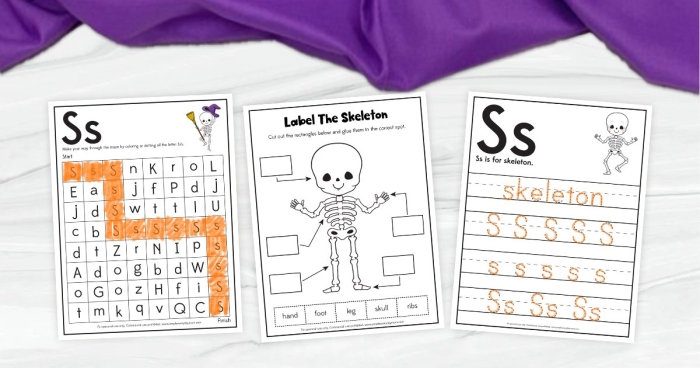 Fourth graders assembling a paper skeleton craft project to learn about human bones and skeletal anatomy