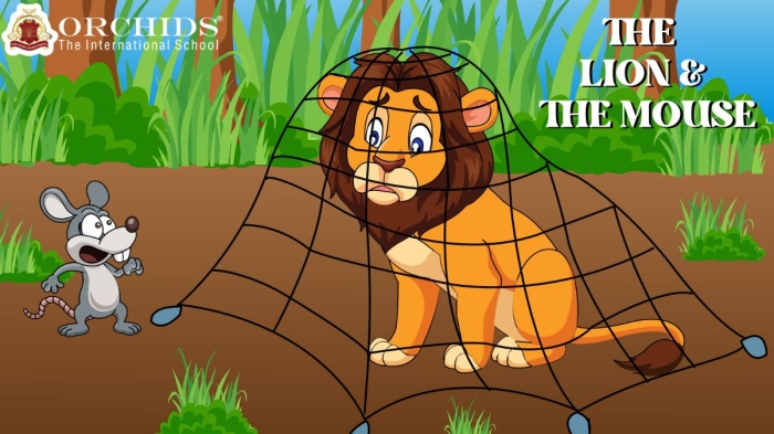 Second grade students reading and discussing the classic Aesop fable about a lion and mouse to identify the story's moral lesson on a handwriting worksheet