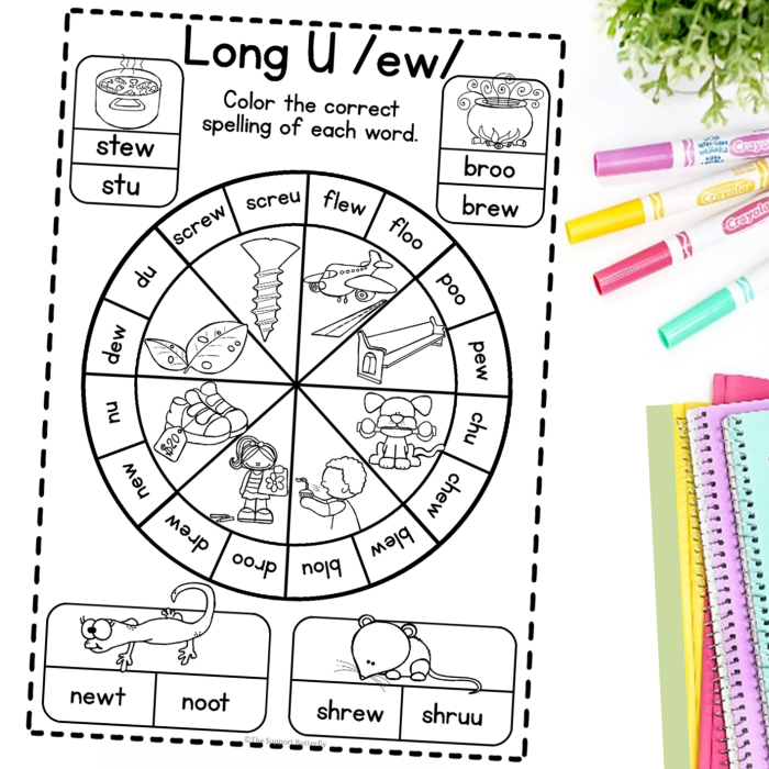 Students completing a long U vowel team sorting activity with words containing ui, ew, and ue letter combinations